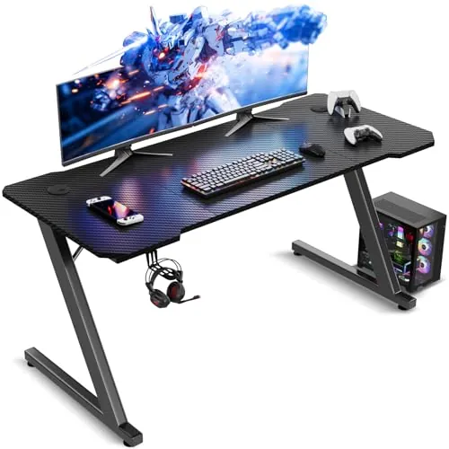 TRIUMPHKEY Mesa Gaming 120 x 60 cm, Escritorio Gaming en Forma de Z Ergonómica, Mesa Gamer de Fibra de Carbono, Mesa para Ordenador con Gancho para Auriculares, Negro